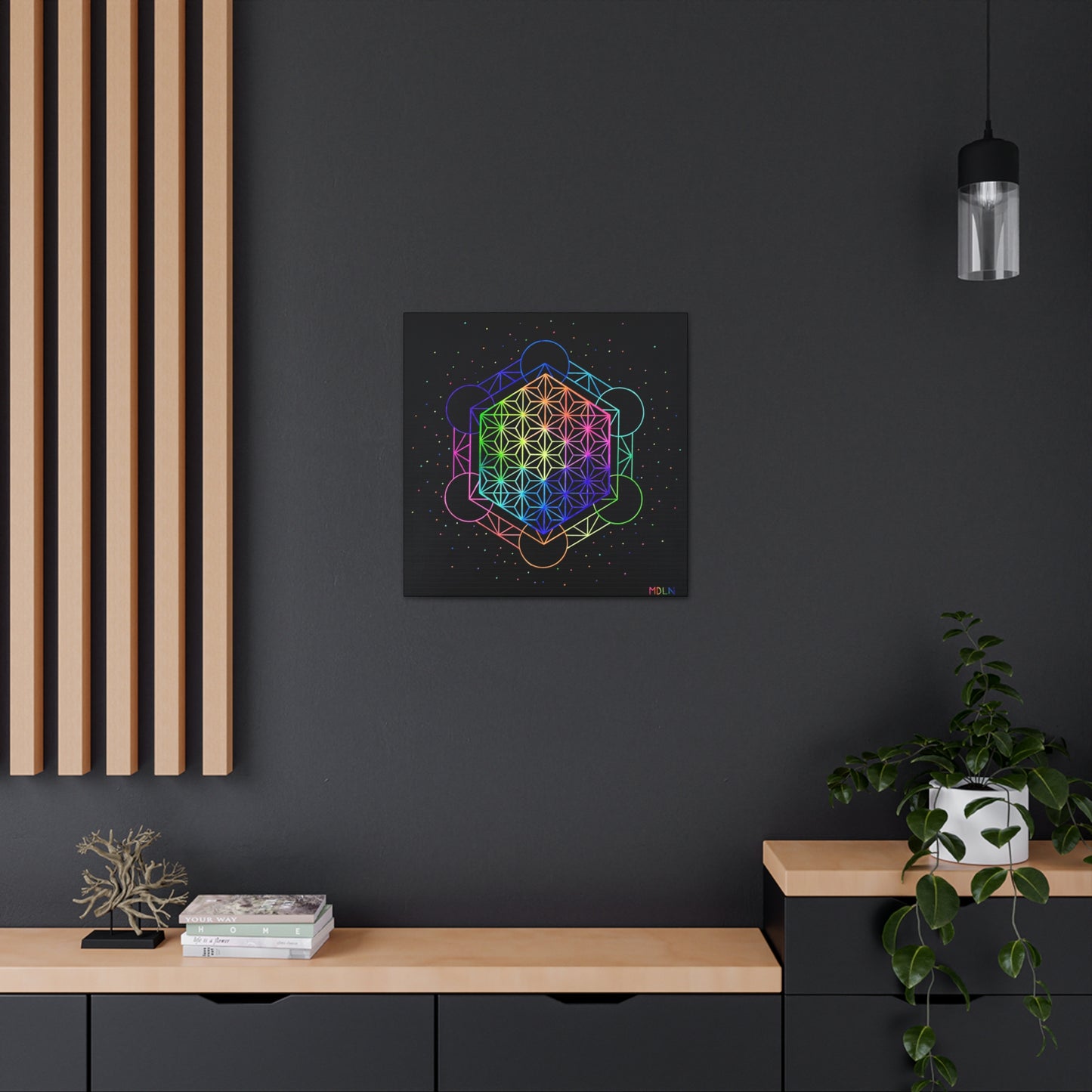 A bright neon sacred geometry art print on canvas of Metatrons Cube overlayed with the Flower of Life Mandala, hanging on a wall in an office