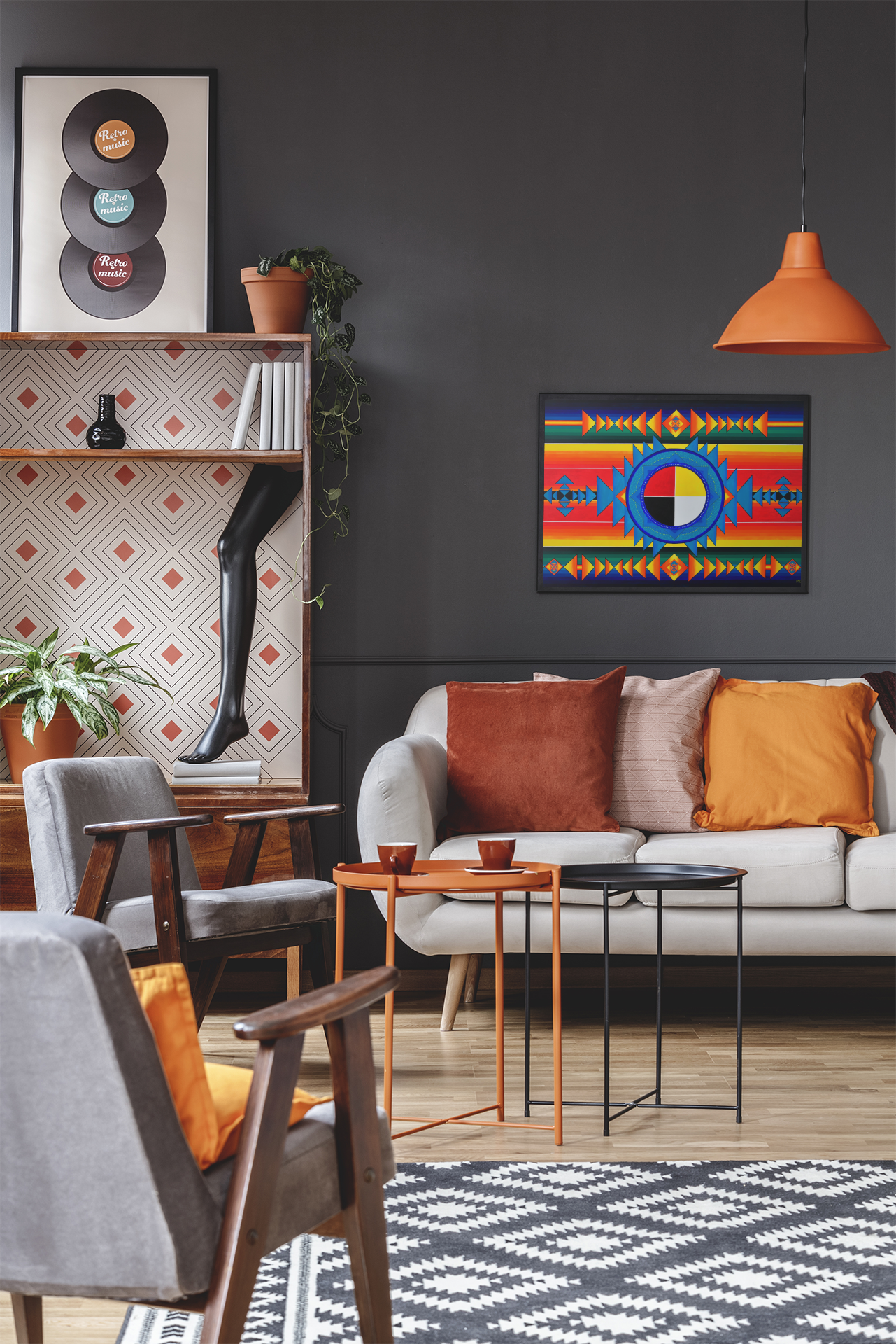 A bright and colorful Indigenous Medicine Wheel art print on canvas, hanging over a couch in a living room