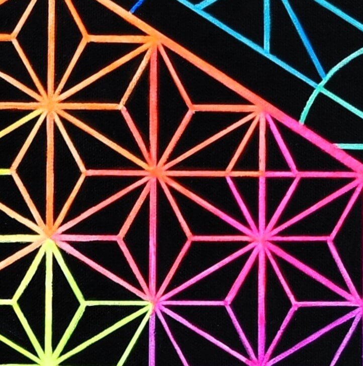 A close up view of sacred geometry painting, flower of life mandala