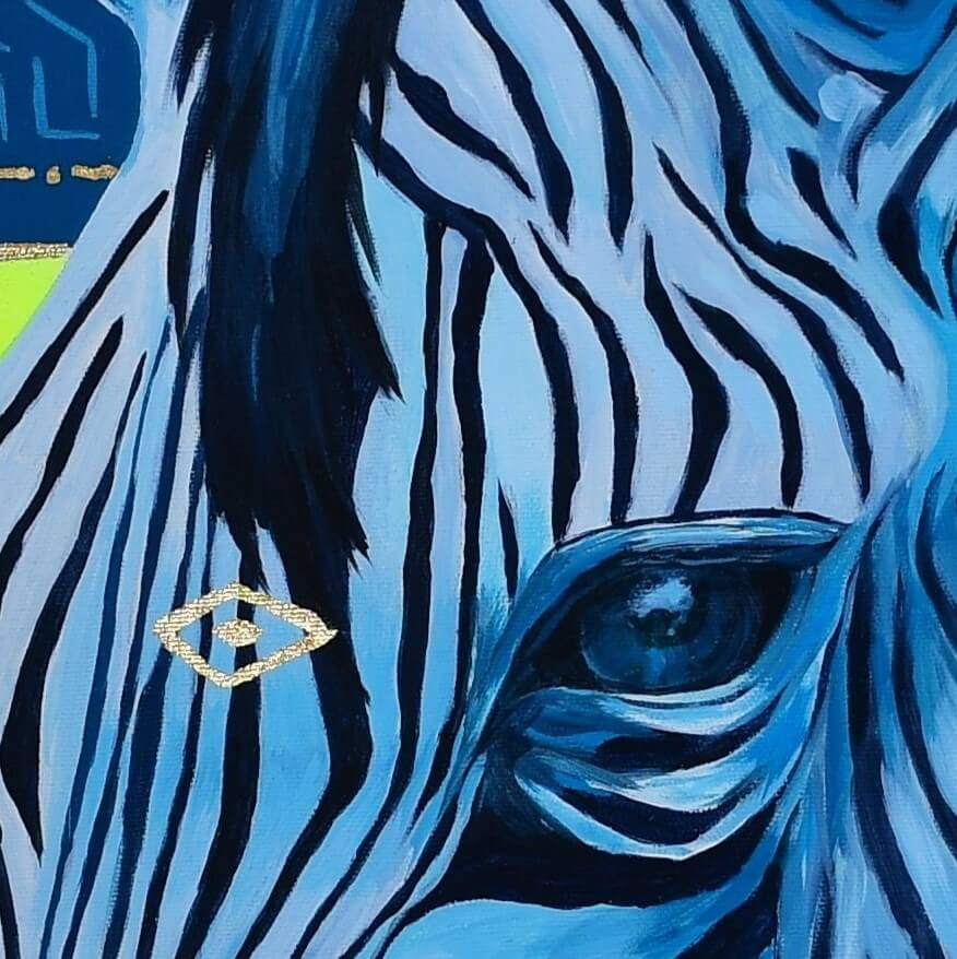 A close up of a bright and colorful original acrylic painting and gold leaf art of a zebra, majestic zebra painting on canvas, zebra art