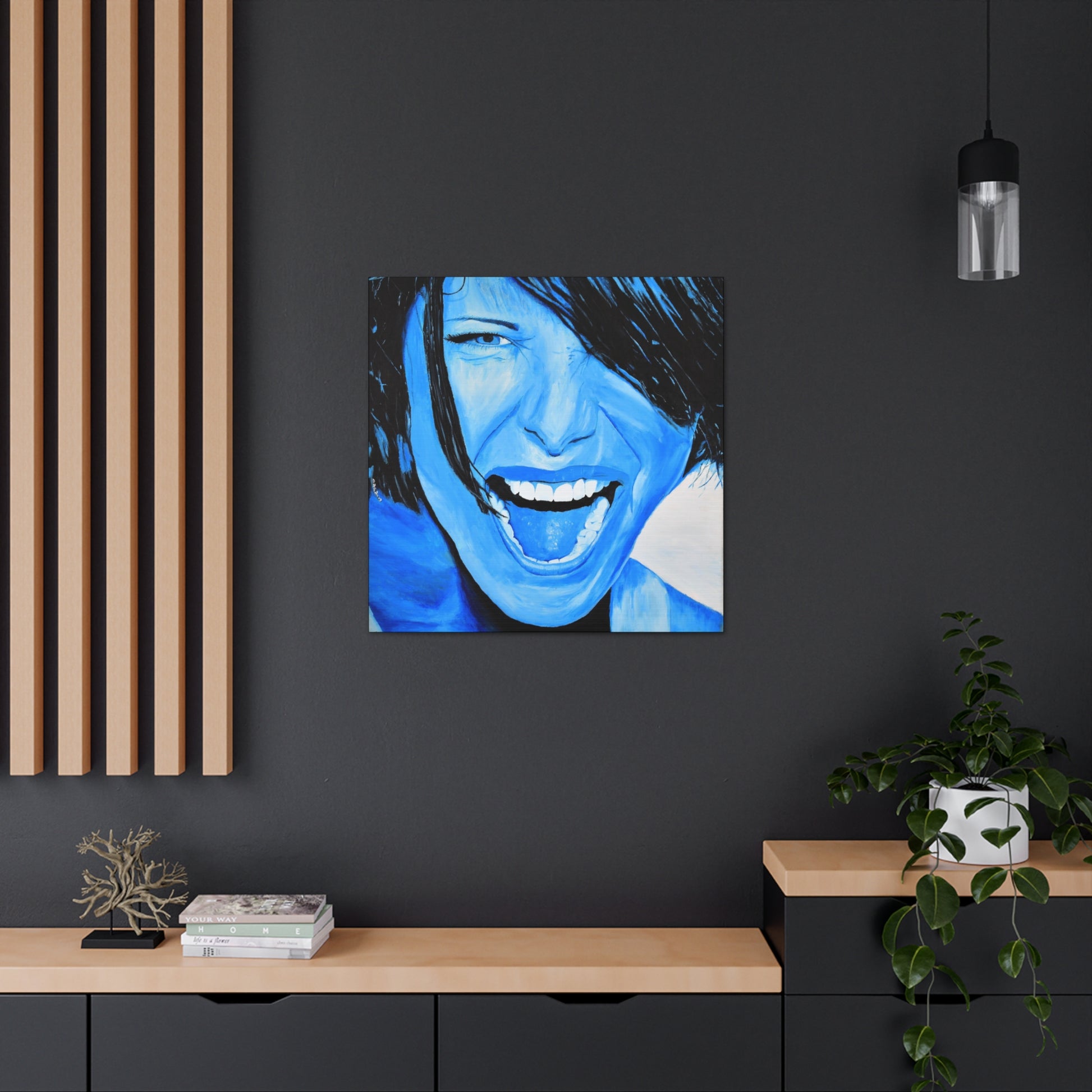 A bright blue art print on canvas of a passionate woman showing emotions, hanging on a wall over cabinets in an office