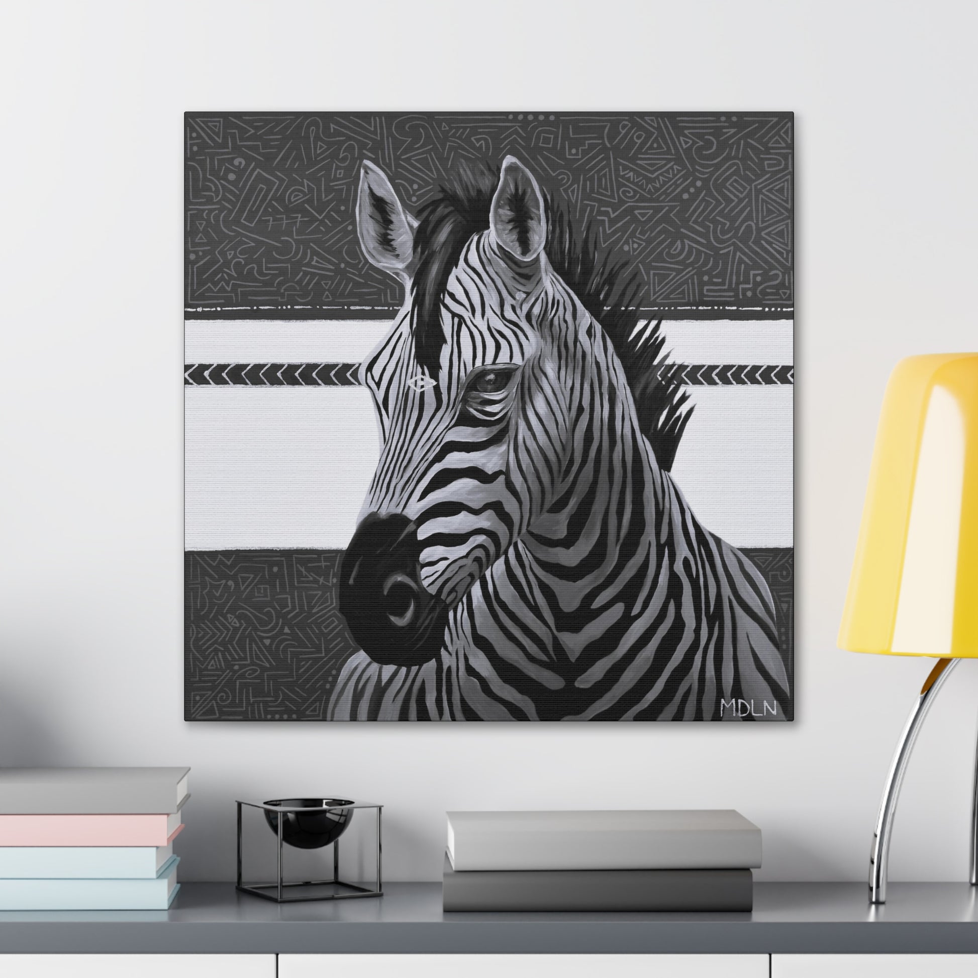 A black and white art print on canvas of a majestic zebra painting on canvas with abstract background, zebra art hanging on a wall over a desk with objects on it