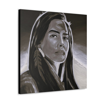 An angled view of a black and white Indigenous art print on canvas of an Aboriginal Woman with feather earring