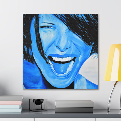 A bright blue art print on canvas of a passionate woman showing emotions, hanging on a wall over a desk with objects on it, woman portrait art