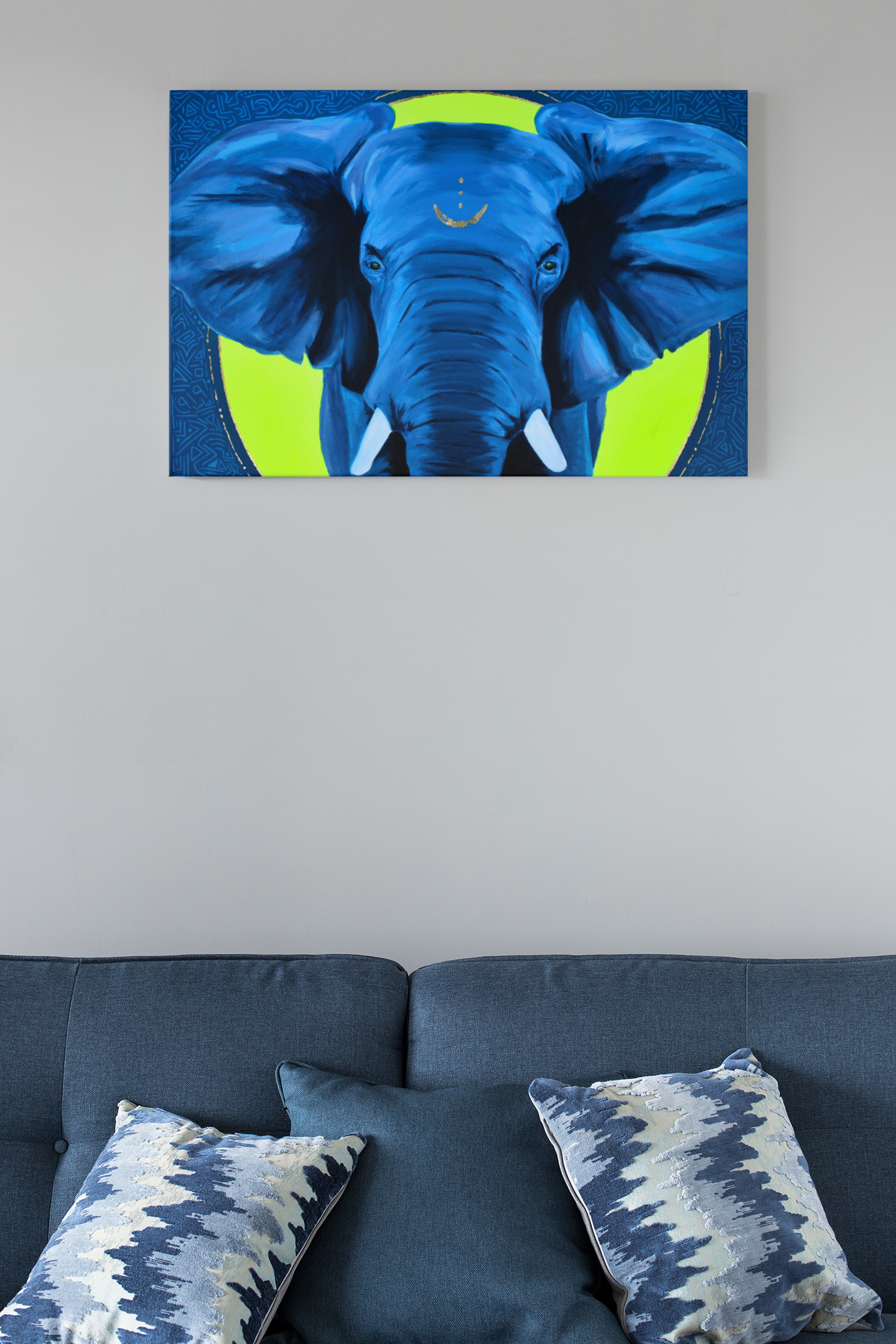 An African Elephant art print on canvas hanging on the wall over a blue couch