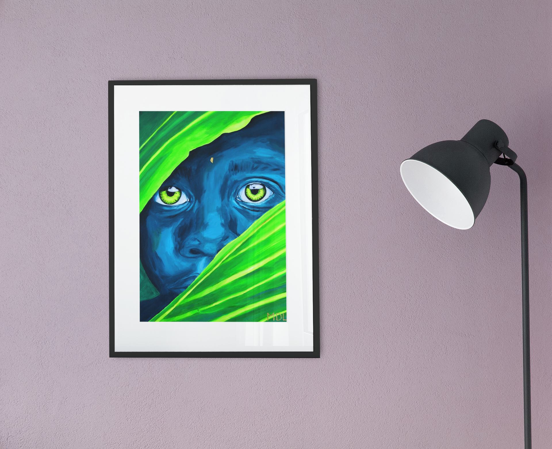 A beautifully black framed giclee art print of an African Boy, hanging on a wall next to a lamp