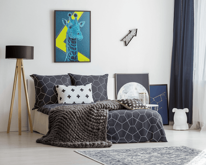 Giclee art print of an Original Acrylic painting with gold leaf of a majestic blue Giraffe Drawing with a blue and neon yellow background, hanging on the wall over a bed in a teenagers room