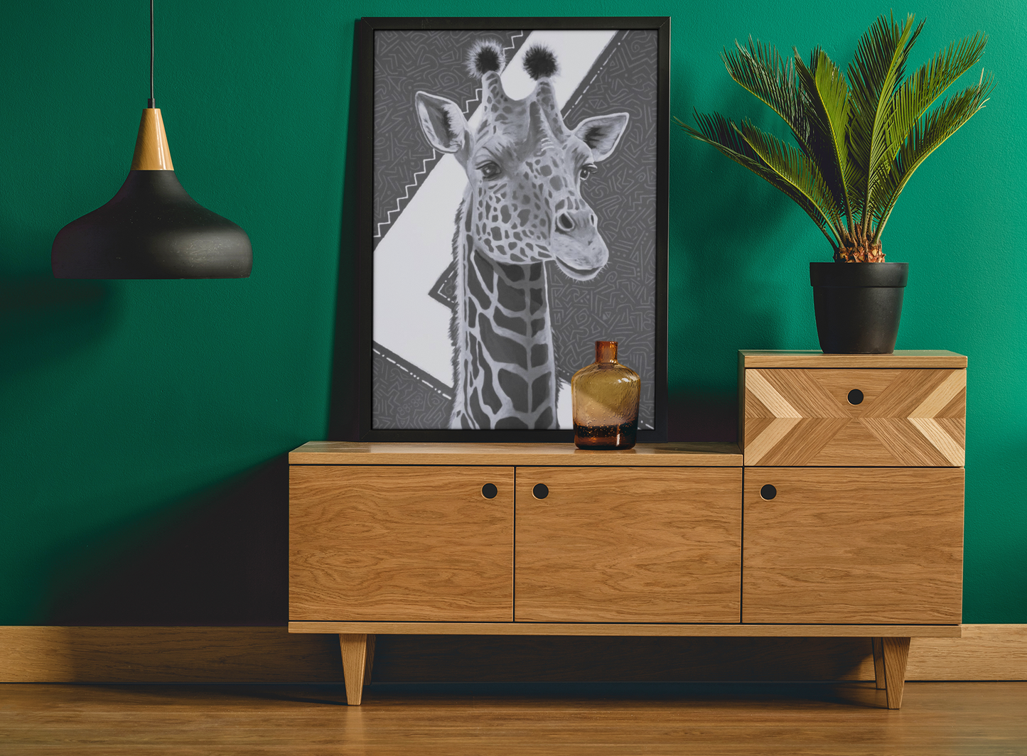 Black and White Canvas print of an original acrylic painting with gold leaf, of a majestic giraffe, with geometric background, leaning against a wall on a credenza next to a plant and lamp