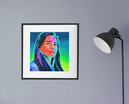 An Indigenous giclee art print of an Aboriginal Woman with feather earring, framed in black with white matting, hanging on wall next to a black lamp