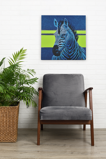 A bright and bold art print on canvas of a majestic zebra painting with blue and neon yellow abstract background, zebra art hanging on the wall above a living room chair next to a plant